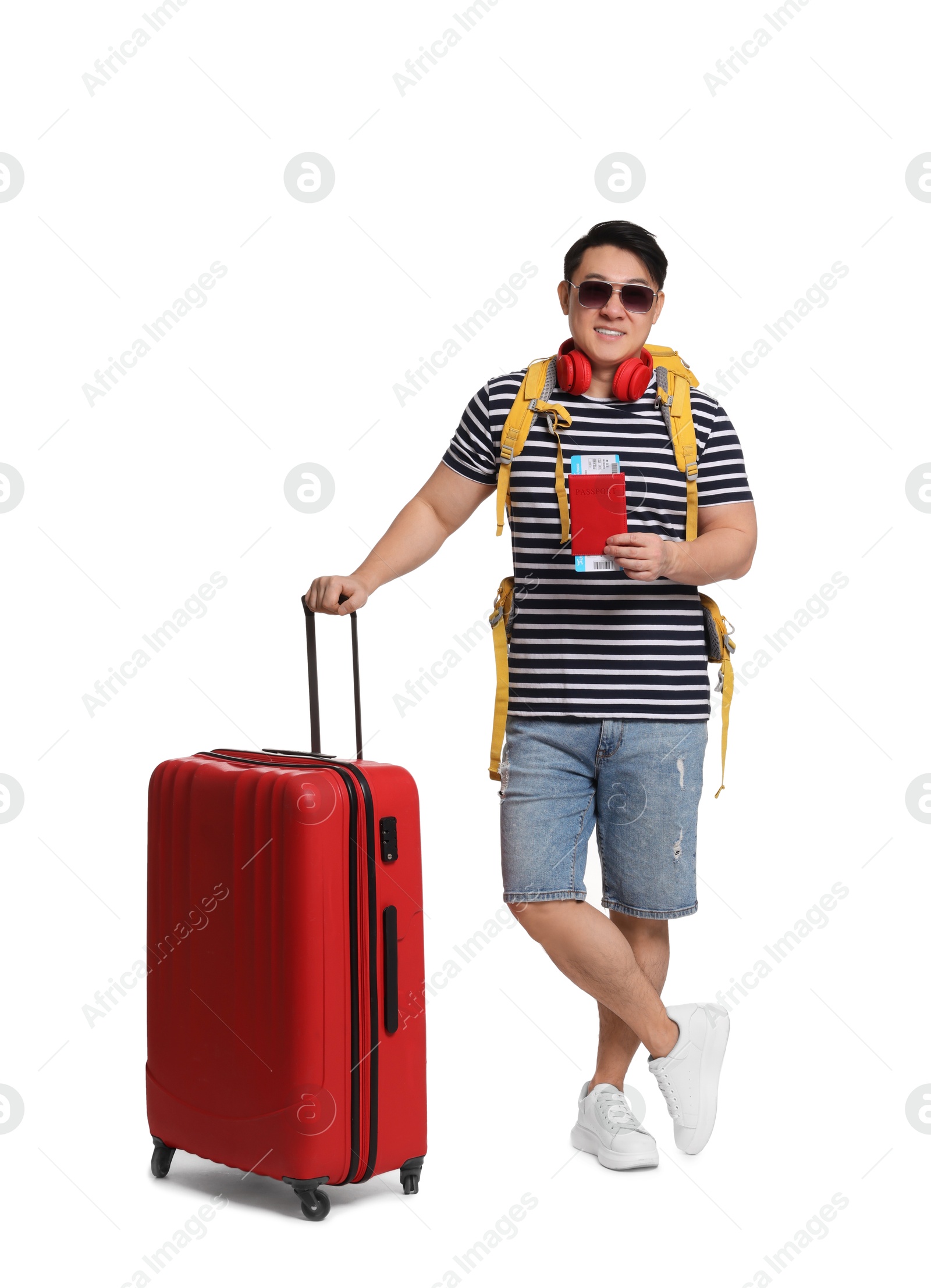 Photo of Traveller with suitcase and passport on white background