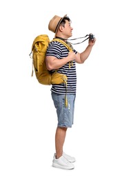 Photo of Traveller with backpack taking photo on white background