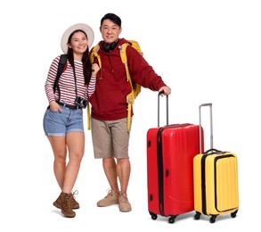 Photo of Happy travellers with suitcases on white background