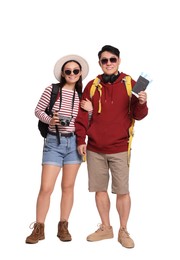 Photo of Happy travellers with passports and camera on white background