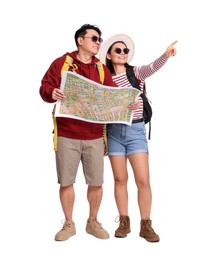 Photo of Happy travellers with map pointing at something on white background