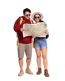 Photo of Happy travellers with map on white background