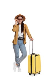 Photo of Happy traveller with suitcase on white background