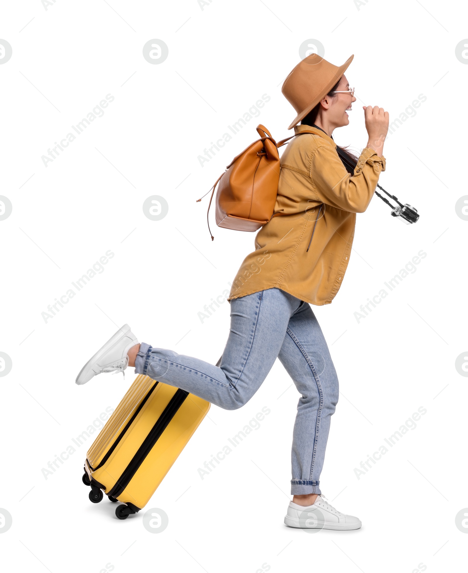 Photo of Traveller with suitcase running on white background