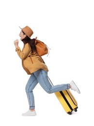 Photo of Traveller with suitcase running on white background