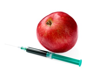 Photo of GMO concept. Red apple and syringe isolated on white