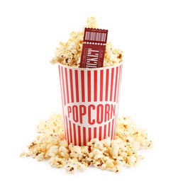 Photo of Tasty popcorn and movie ticket isolated on white