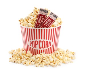 Photo of Tasty popcorn and movie tickets isolated on white