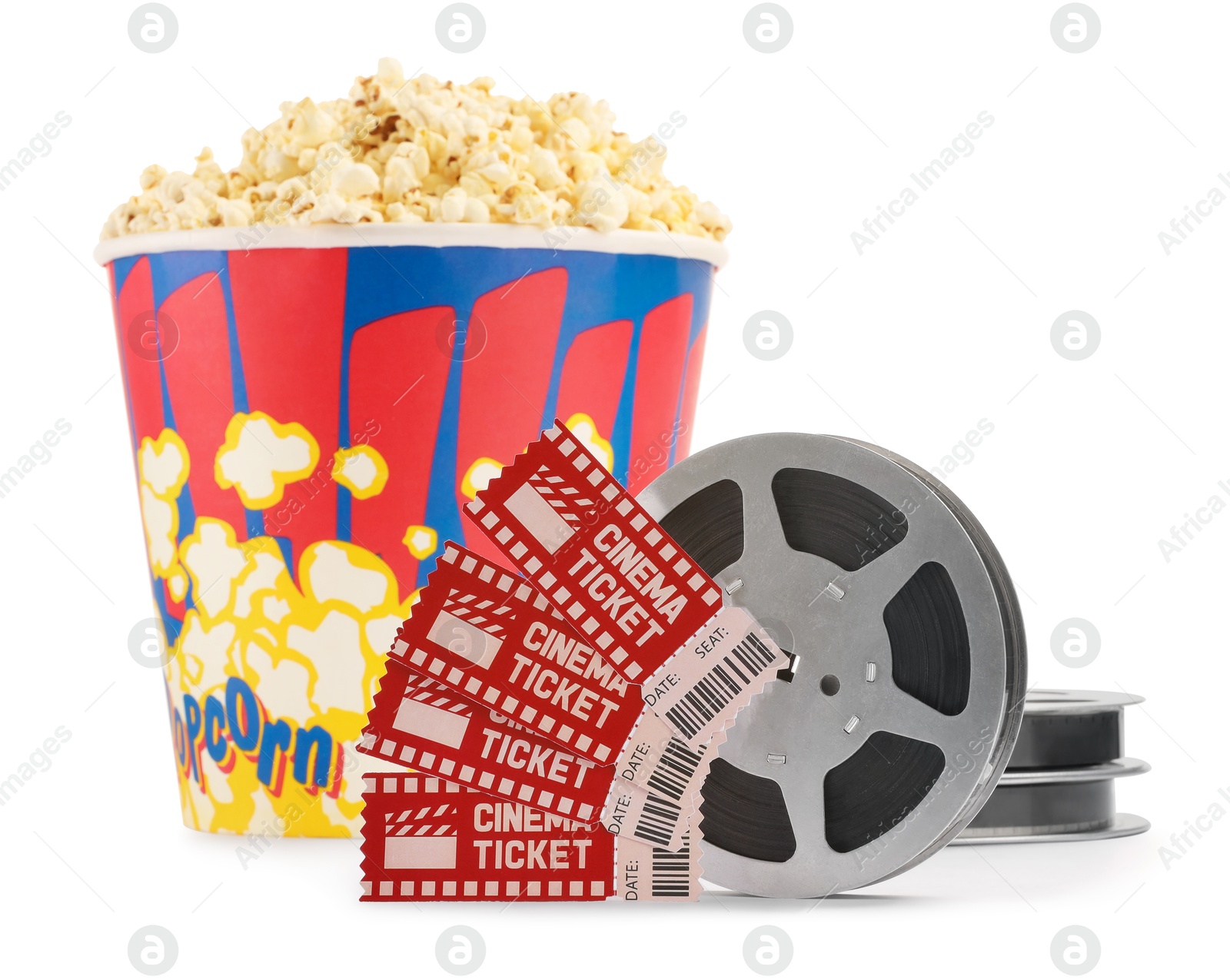 Photo of Tasty popcorn, film reels and movie tickets isolated on white