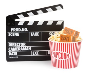 Photo of Tasty popcorn, clapper and movie tickets isolated on white