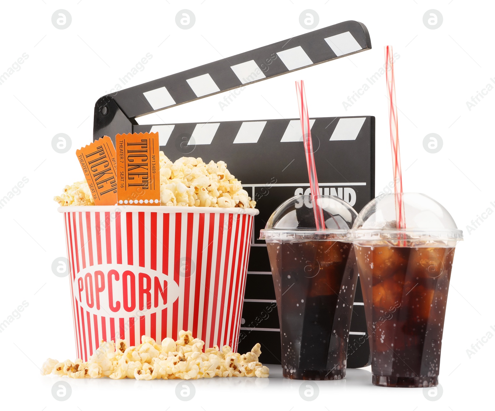 Photo of Tasty popcorn, drinks, clapper and movie tickets isolated on white