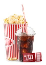 Photo of Tasty popcorn, drink and movie ticket isolated on white