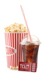 Photo of Tasty popcorn, drink and movie ticket isolated on white