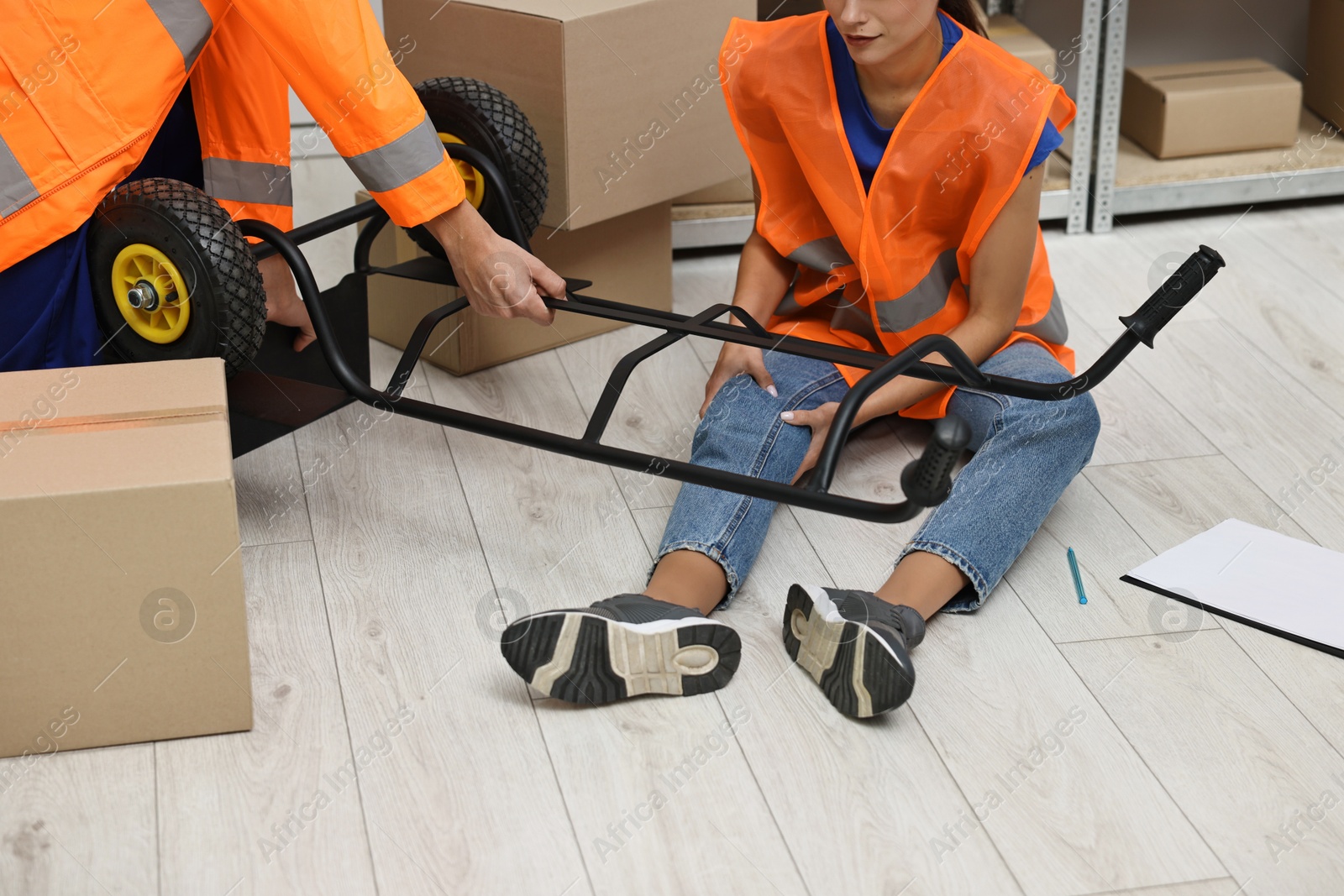 Photo of Man helping his injured colleague after accident at work, closeup