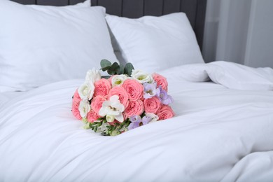 Photo of Wedding bouquet of beautiful flowers on bed