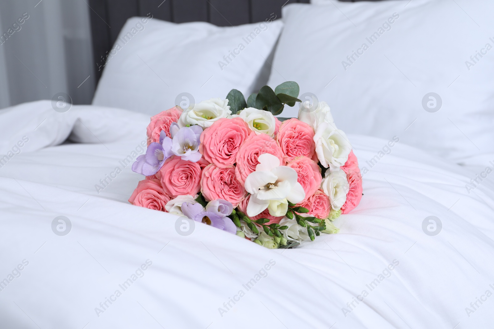 Photo of Wedding bouquet of beautiful flowers on bed