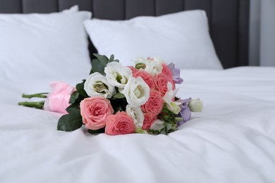 Photo of Wedding bouquet of beautiful flowers on bed, closeup