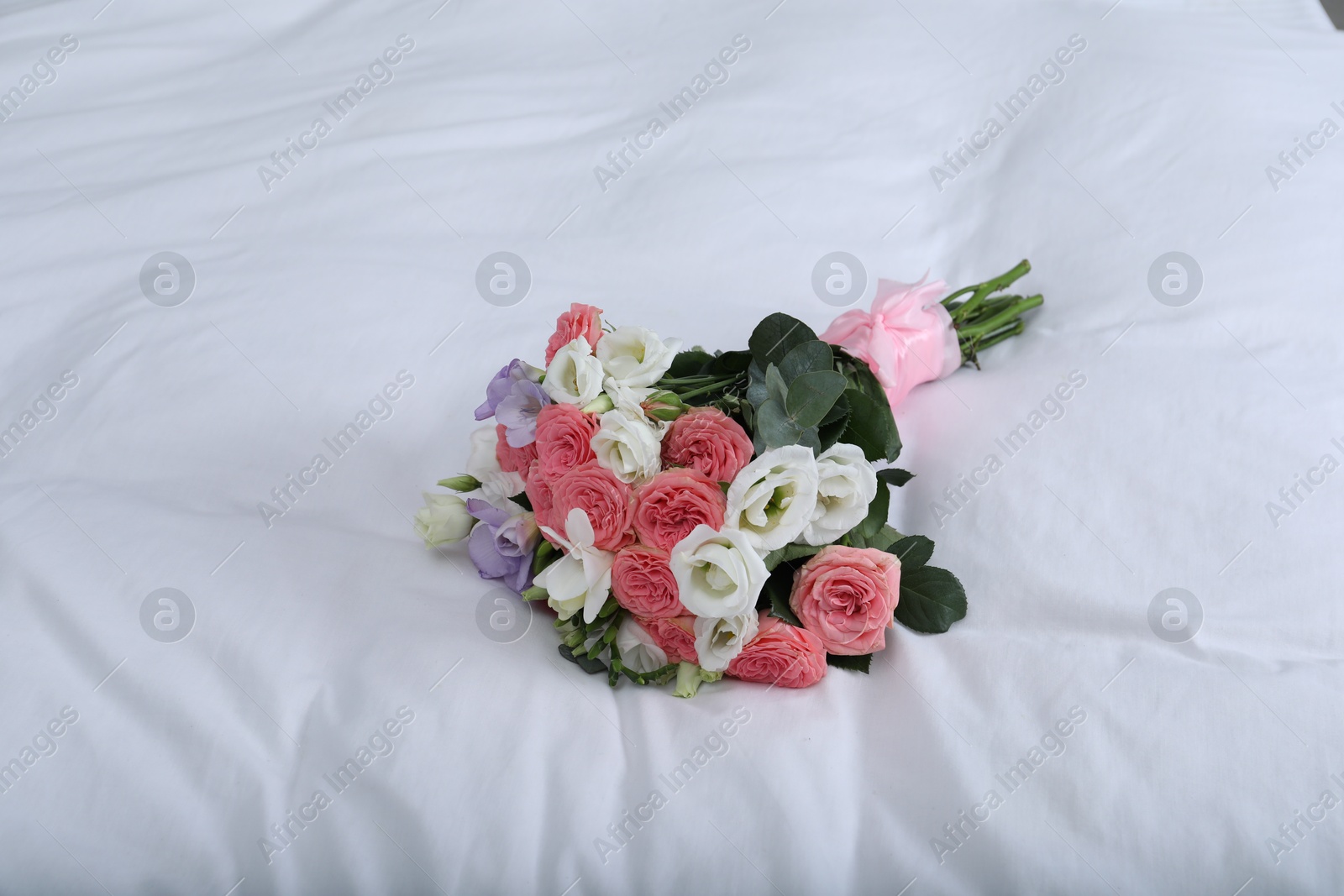 Photo of Wedding bouquet of beautiful flowers on linens