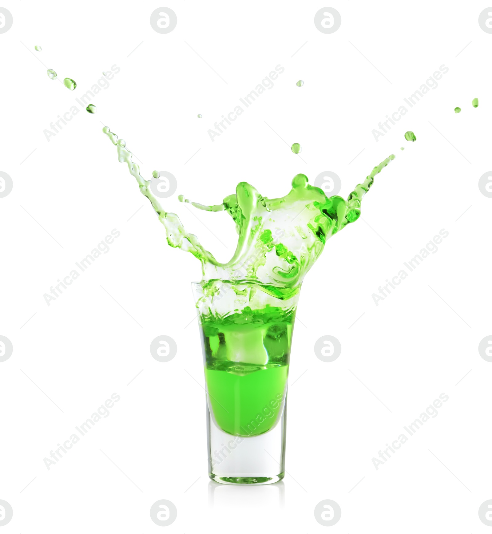 Photo of Delicious absinthe splashing in shot glass on white background