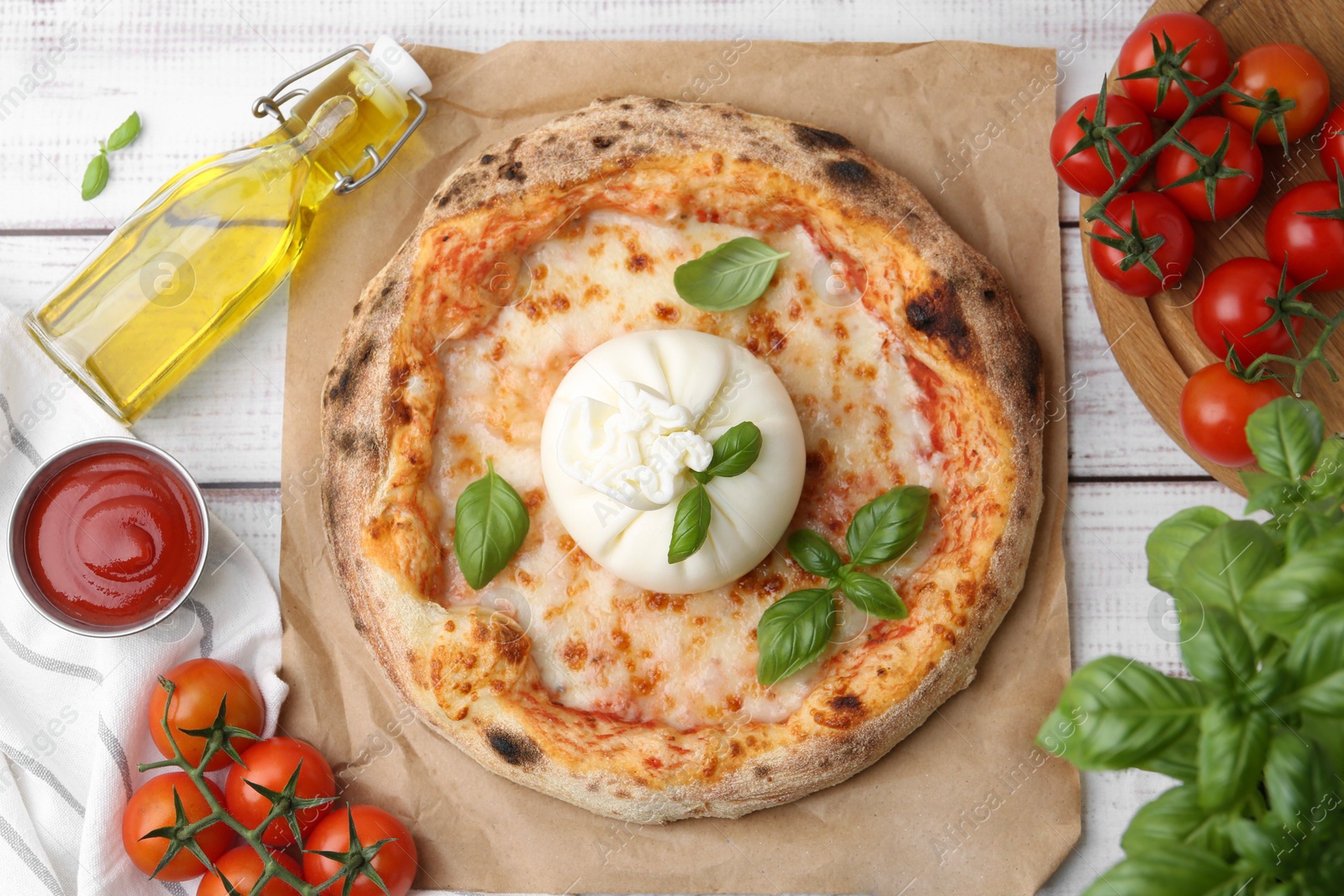 Photo of Delicious pizza with burrata cheese served on wooden table, top view