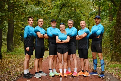 Group of athletic people together in park