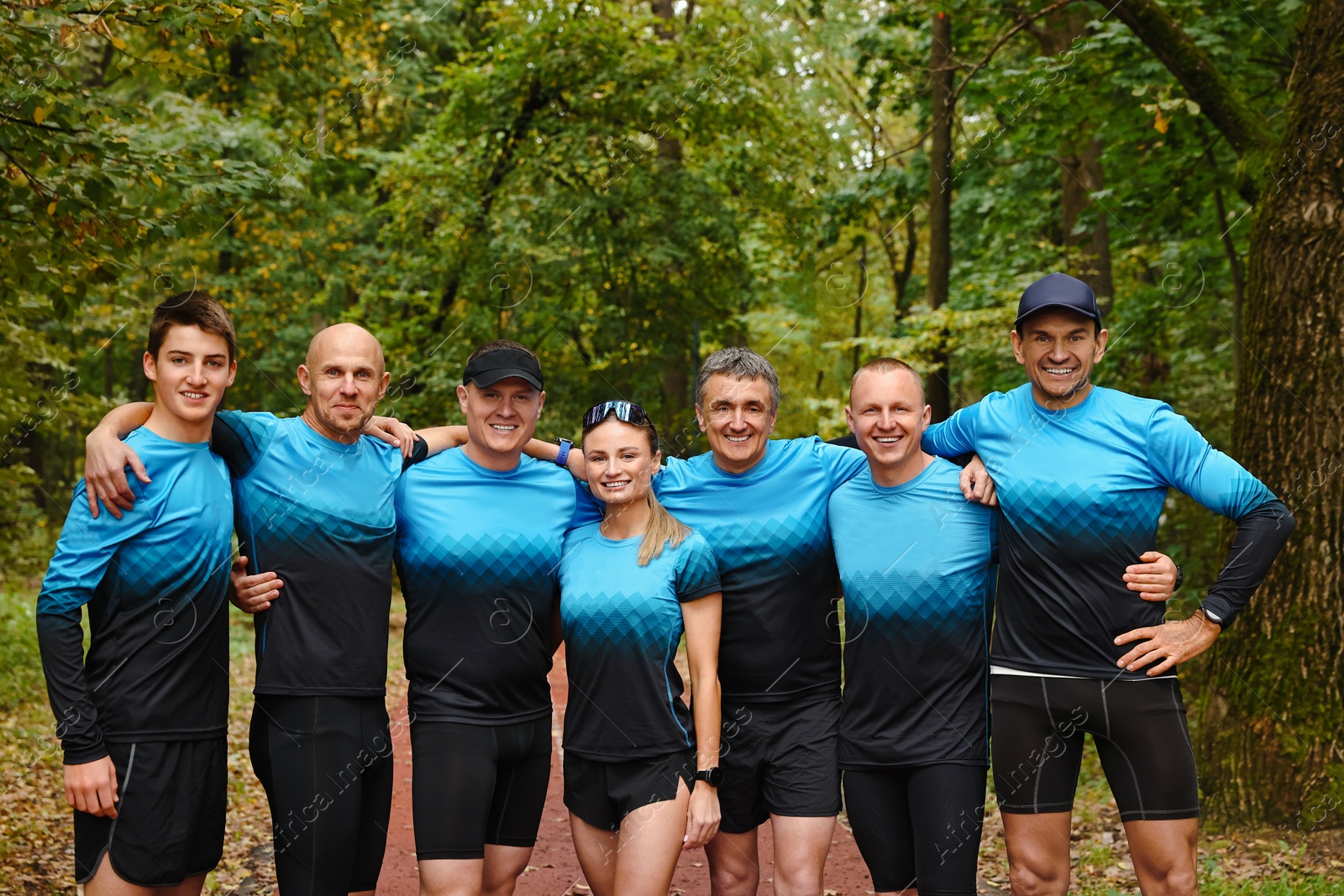 Photo of Group of athletic people together in park