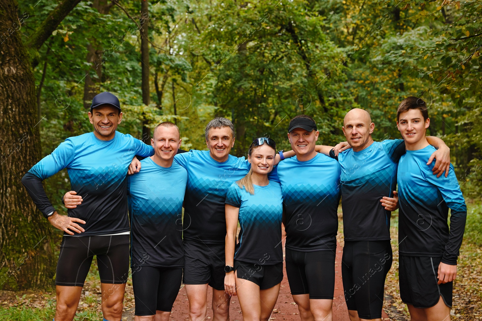 Photo of Group of athletic people together in park