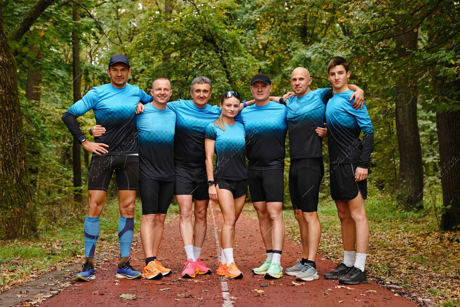 Photo of Group of athletic people together in park