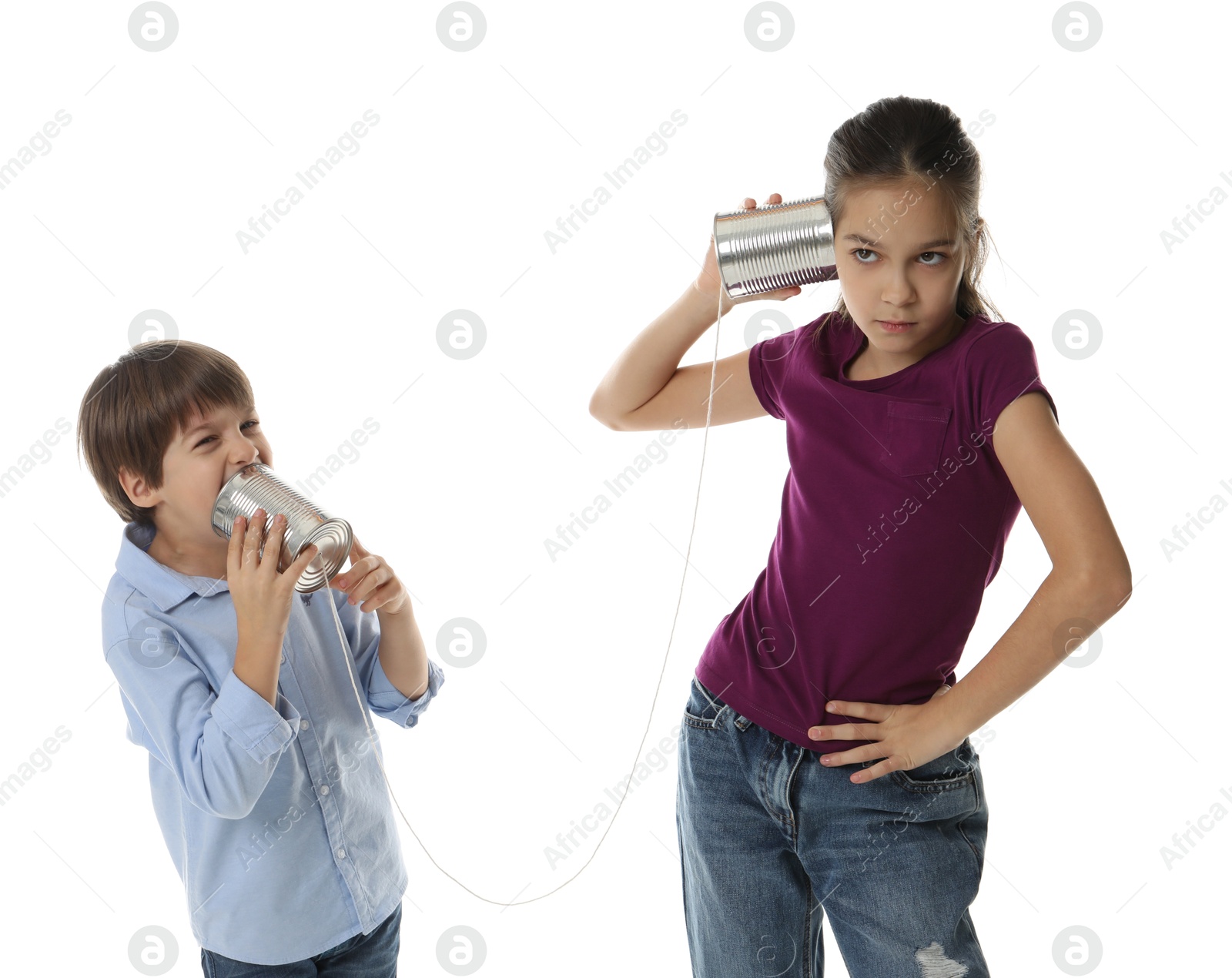 Photo of Girl and boy talking on tin can telephone against white background