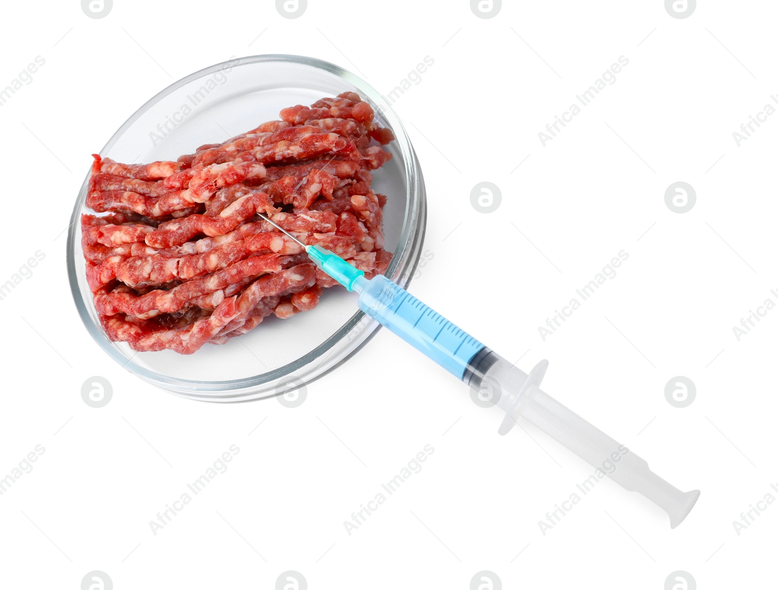 Photo of GMO concept. Minced meat and syringe isolated on white