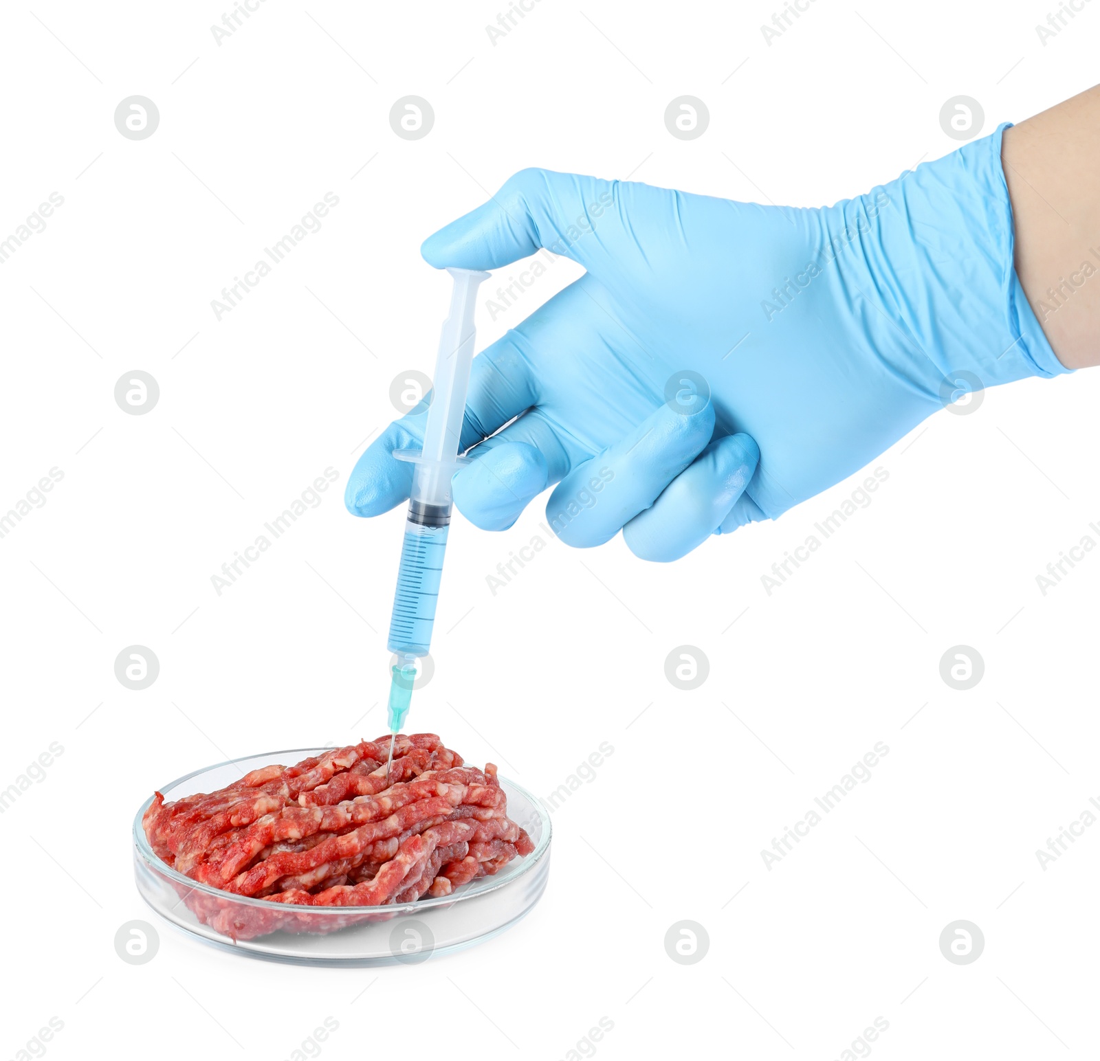 Photo of GMO concept. Scientist injecting something into minced meat on white background, closeup