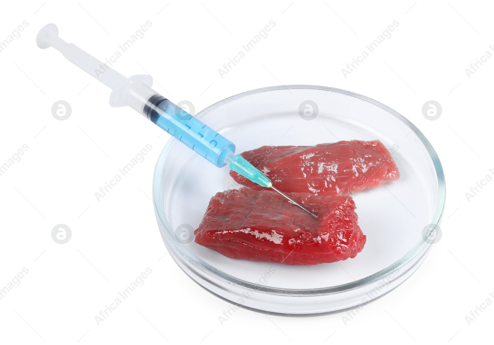 Photo of GMO concept. Pieces of meat and syringe isolated on white