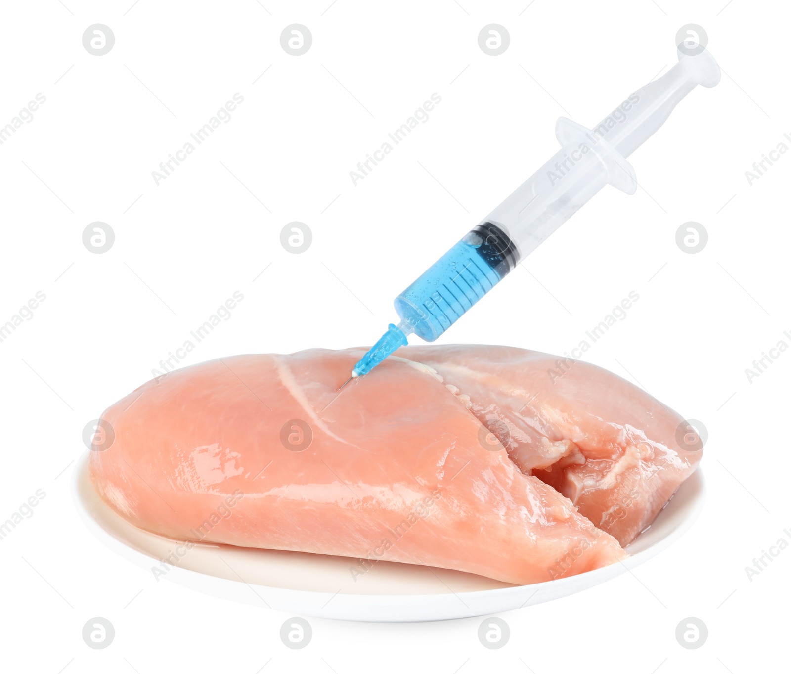 Photo of GMO concept. Chicken breasts and syringe isolated on white