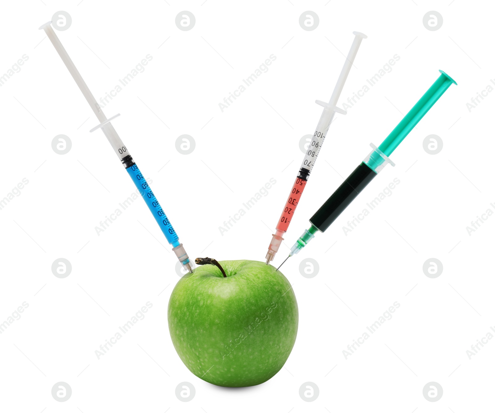 Photo of GMO concept. Fresh apple and syringes isolated on white