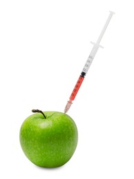 Photo of GMO concept. Fresh apple and syringe isolated on white