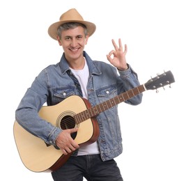 Photo of Happy man with guitar showing okay gesture on white background