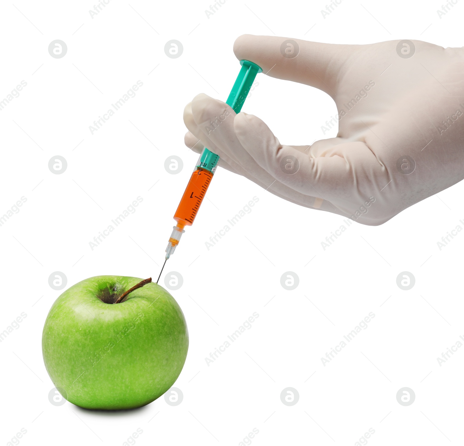 Photo of GMO concept. Scientist injecting something into green apple against white background, closeup