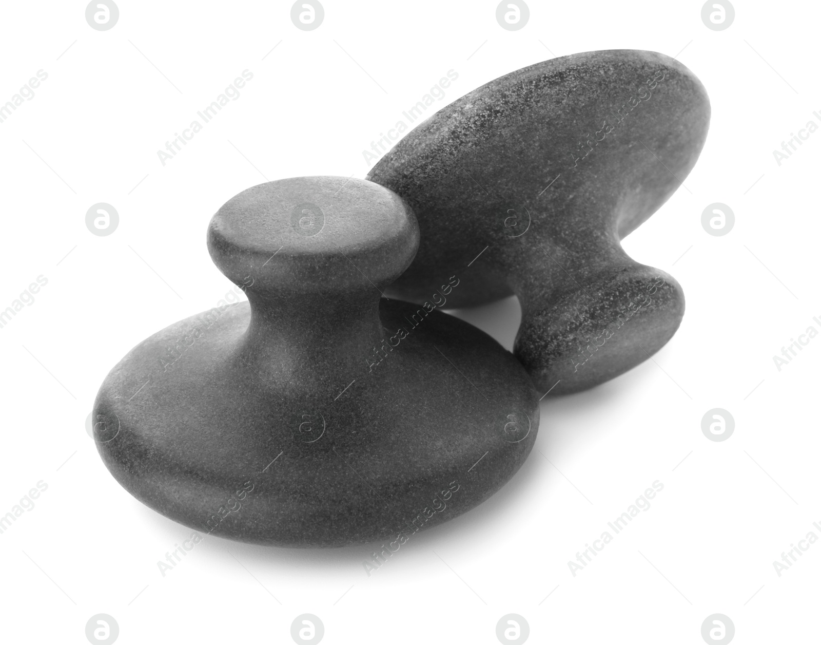 Photo of Massage stones isolated on white. Spa treatment