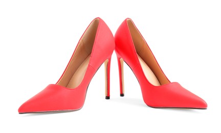 Photo of Pair of red high-heeled shoes isolated on white