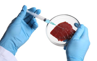 Photo of GMO concept. Scientist injecting something into piece of meat on white background, closeup