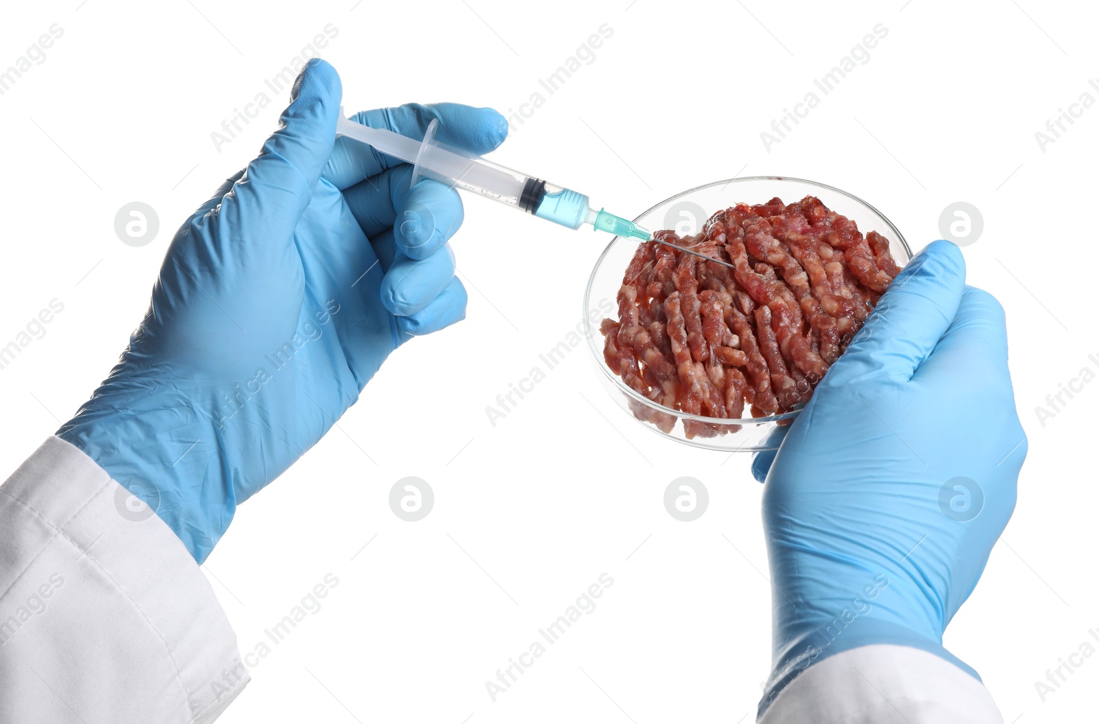 Photo of GMO concept. Scientist injecting something into minced meat on white background, closeup