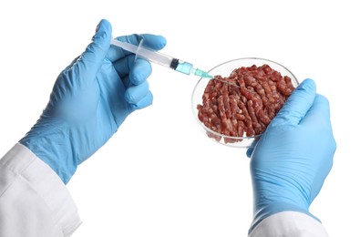 Photo of GMO concept. Scientist injecting something into minced meat on white background, closeup