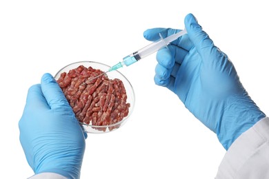 Photo of GMO concept. Scientist injecting something into minced meat on white background, closeup