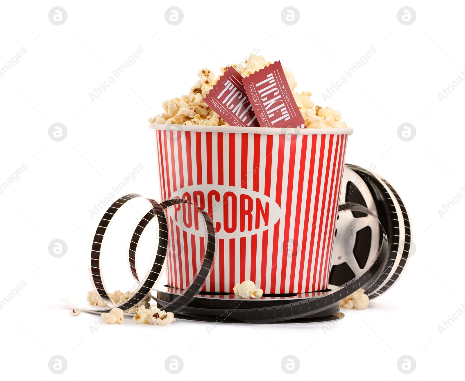 Photo of Tasty popcorn, film reel and movie tickets isolated on white