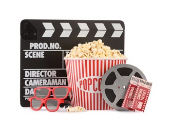 Photo of Tasty popcorn, film reel, clapper, glasses and movie tickets isolated on white