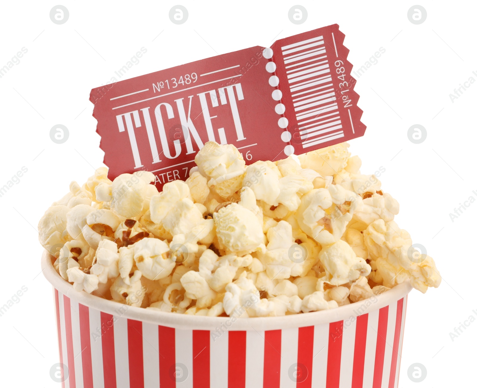 Photo of Tasty popcorn and movie ticket isolated on white