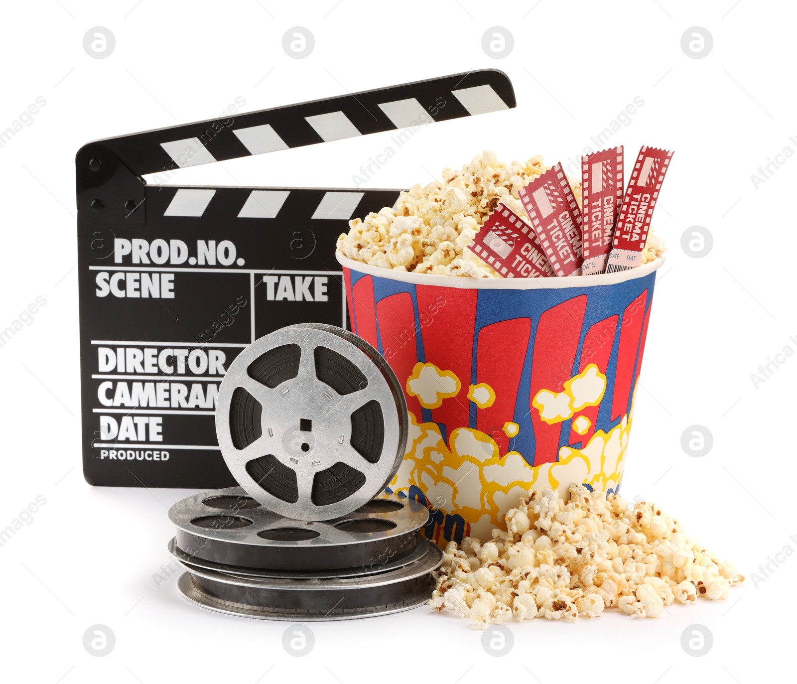 Photo of Tasty popcorn, movie tickets, clapper and film reels isolated on white