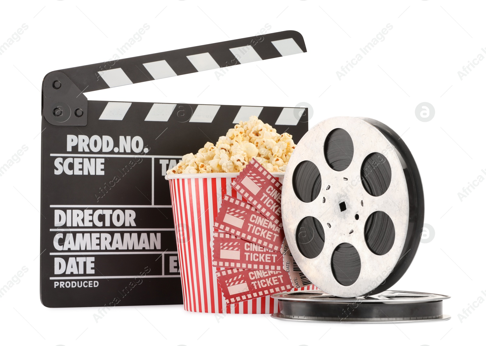 Photo of Tasty popcorn, movie tickets, clapper and film reels isolated on white