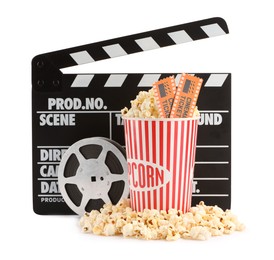 Photo of Tasty popcorn, clapper and movie tickets isolated on white