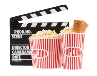 Photo of Tasty popcorn, clapper and movie tickets isolated on white